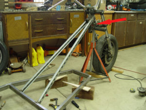Photo of front fork being welded to chopper trike