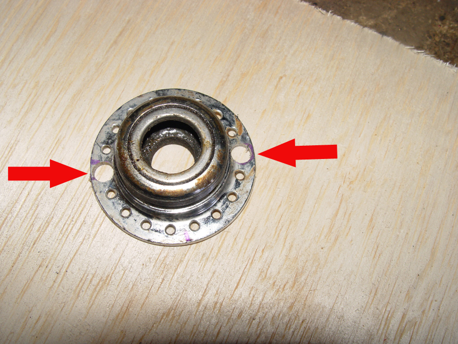 Photo of mounting holes drilled in wheel hub disk